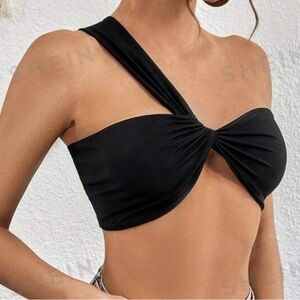 Woman one shoulder black top